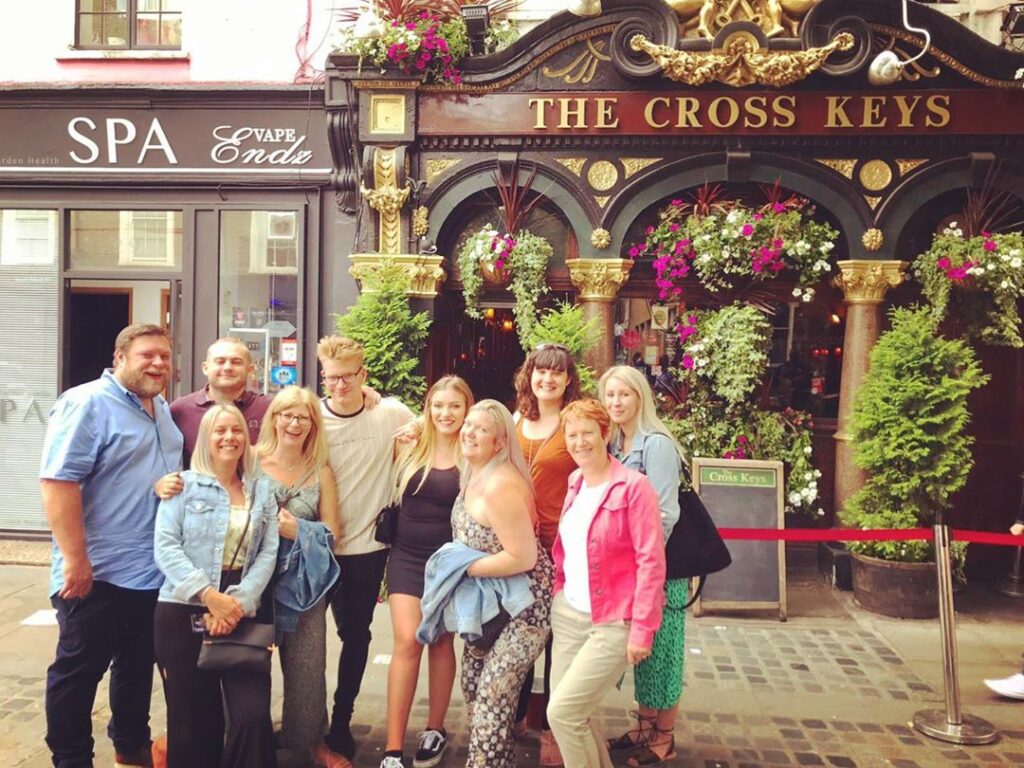 A London Pub tours group picture in front of historic London pub 