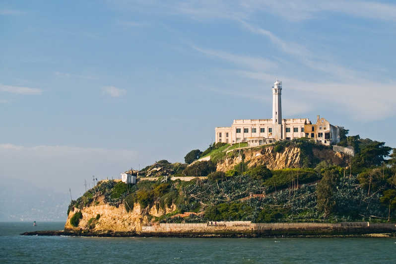 Wide shot of Alcatraz island, with water and prison visible
