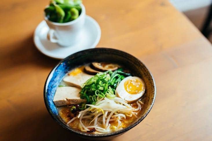Ramen noodles with pork, egg and fresh herbs at Tsukuyomi in Mile End