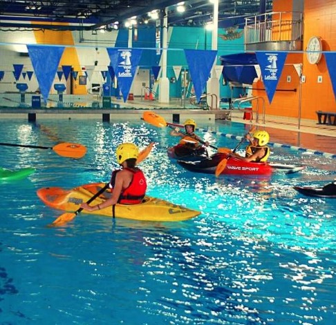 Kids Kayaking in a pool at the Montreal Aquadome