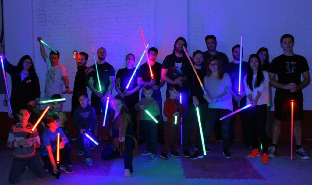 A group of people playing with Saber