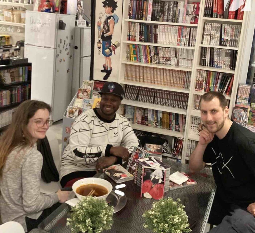 3 people in a manga store