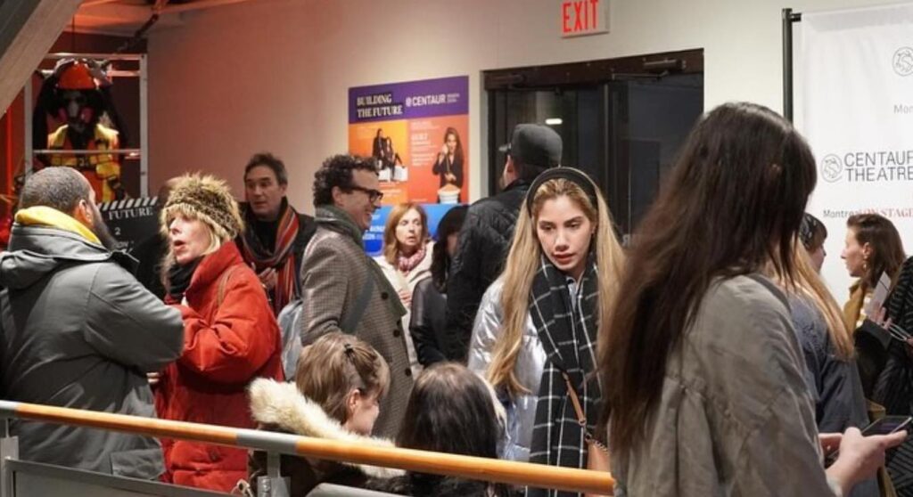 People waiting to go see a play at Centaur Theatre