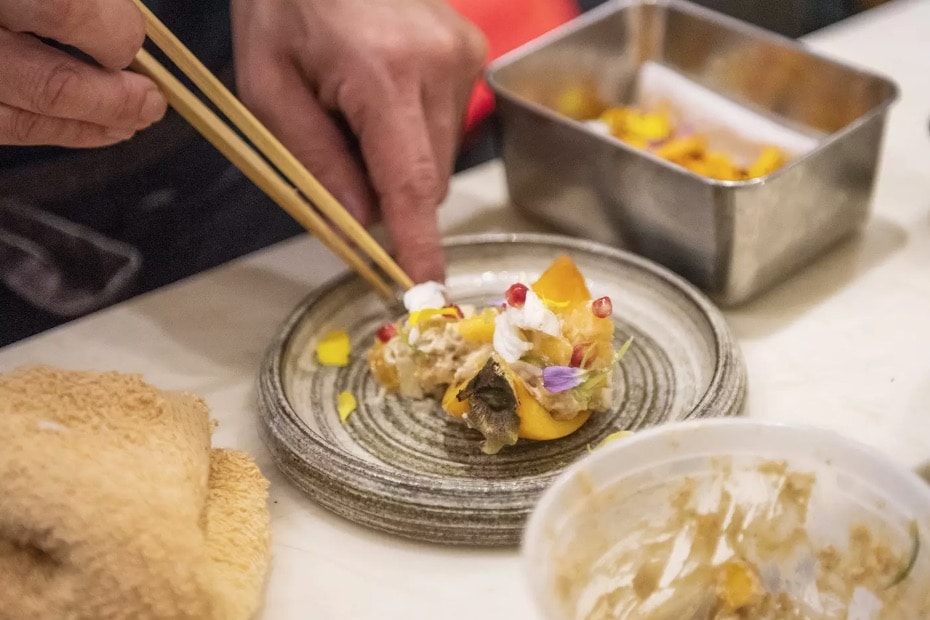 yukashi toronto restaurants chef preparing plate