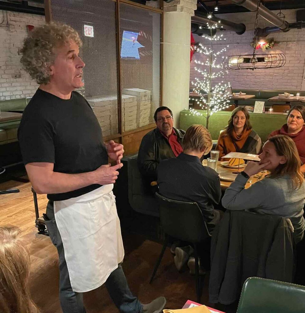A chef speaking to a group of people from Pizza city usa tour